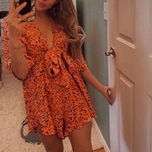 Cute small red romper, fits small or medium. Perfect for vacation!